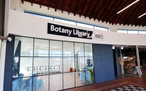 Library shopfront entrance inside a mall with large glazed facade