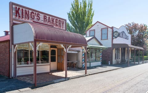 Heritage village streetscape with King's Bakery and Printers shopfronts