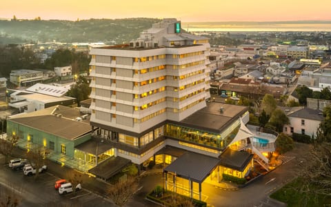 Aerial view of multi-storey hotel building in town centre at dusk