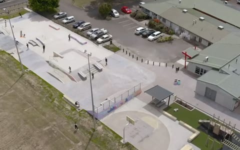 Aerial view of a community centre and surrounding car park and skate park