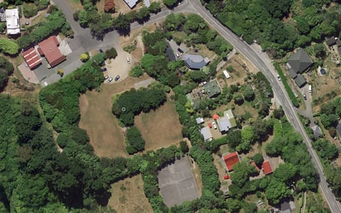 Aerial satellite view of reserve with buildings, parking and grounds