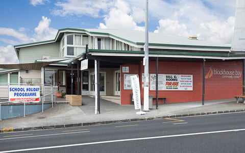 Community centre building on main road with signage for hall hire