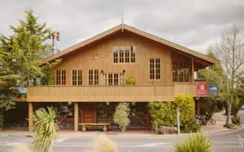 Exterior of Powderhorn Chateau, a two-storey timber alpine chalet