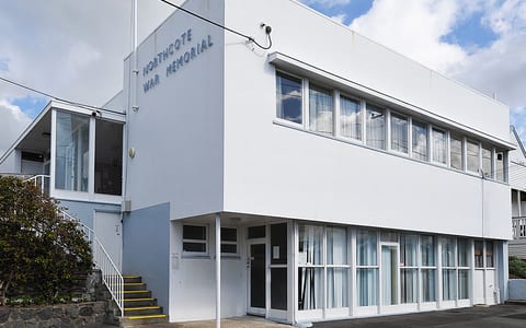 Two-storey white rendered building with signage reading Northcote War Memorial