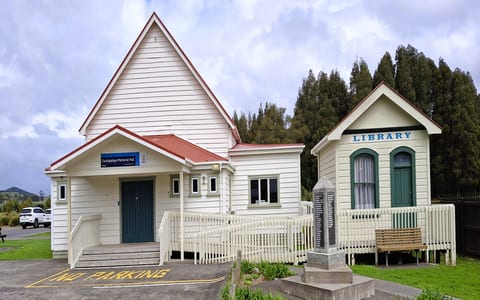 White timber memorial hall and adjacent library building