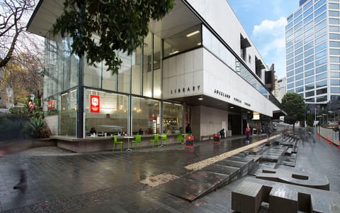 Auckland City Library exterior with glass facade and street-level seating