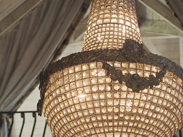 Close-up of ornate chandelier with warm lighting