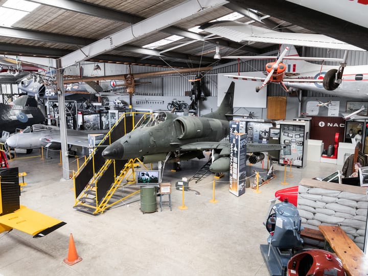 Aviation museum hangar with vintage aircraft and displays