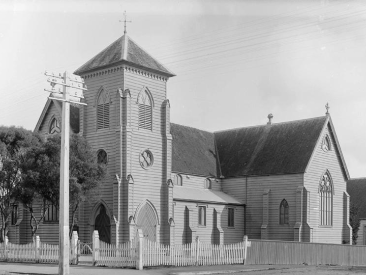 Historic timber church exterior with tower, black and white archival photograph