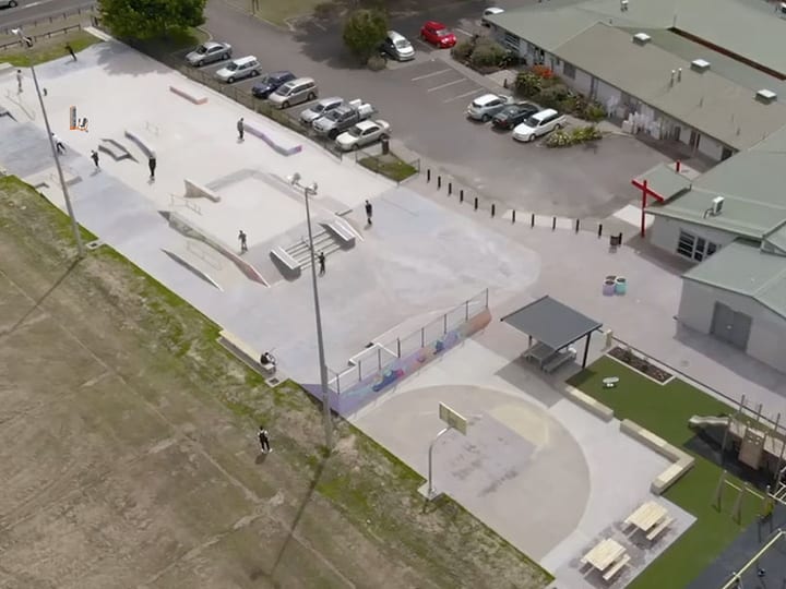 Aerial view of a community centre and surrounding car park and skate park