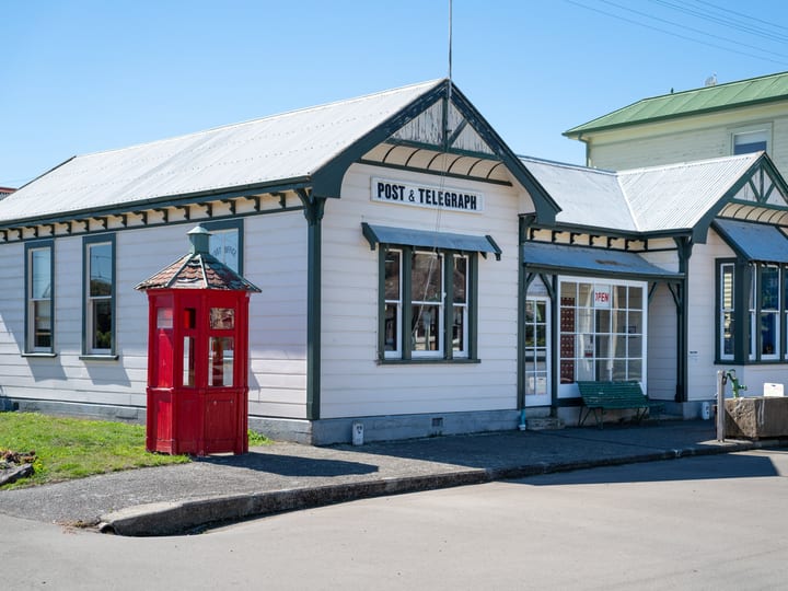 Heritage Post and Telegraph building with red telephone kiosk out front