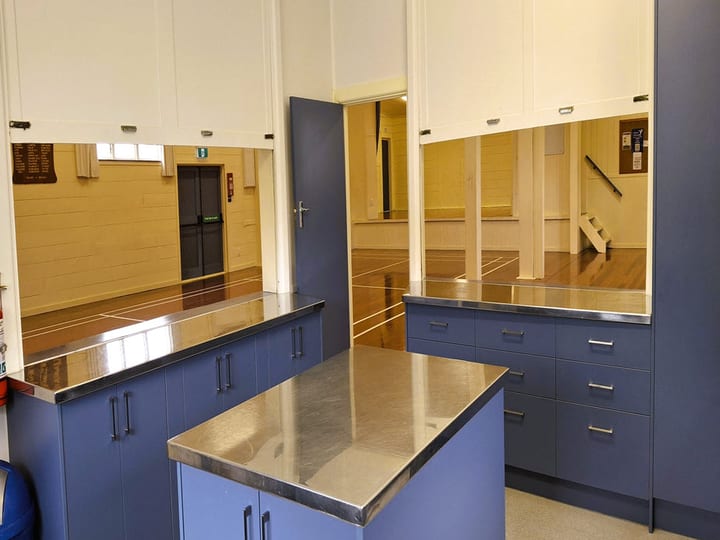 Hall kitchen servery window looking into main hall from prep area