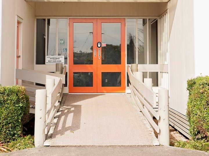 Front entry of community centre building with curved canopy