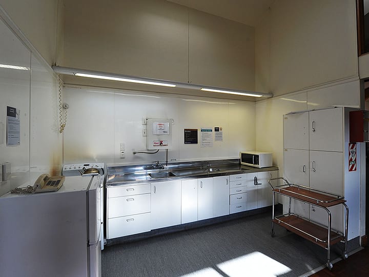 Community hall kitchen from alternate angle showing bench and appliances
