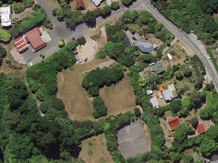 Aerial satellite view of reserve with buildings, parking and grounds