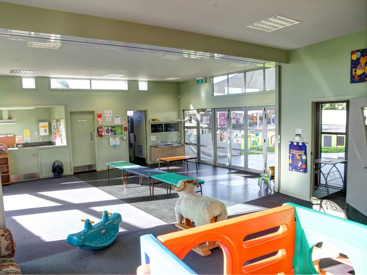 Children's play room with play equipment and sliding doors
