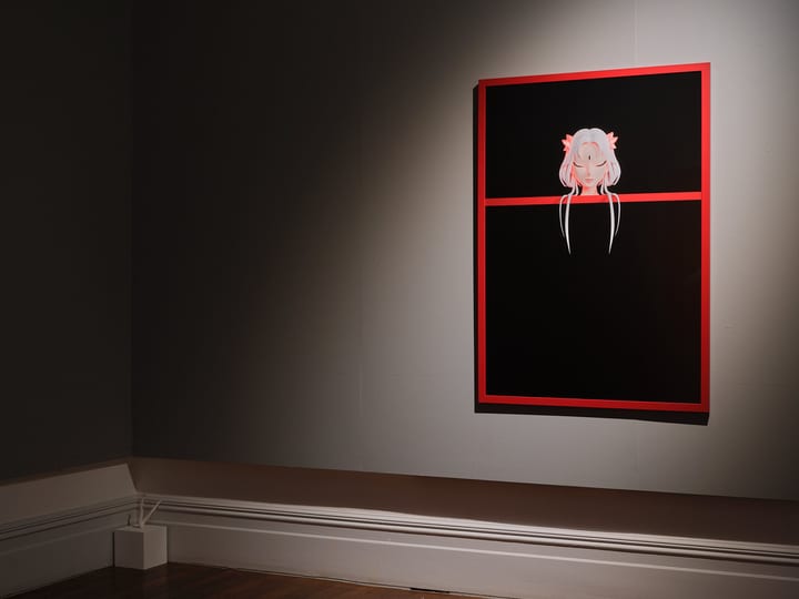 Dark-walled gallery room with single spotlit artwork in red frame, timber floor, ornate cornice