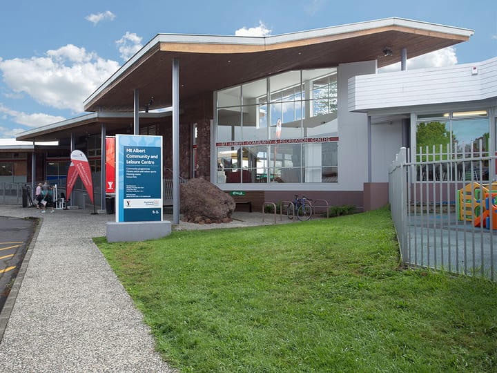 Community and leisure centre entrance with canopy, signage and landscaping