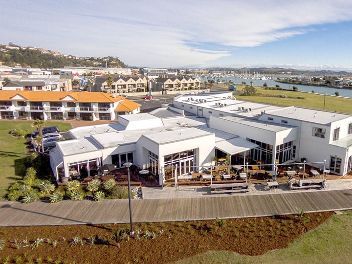 Aerial view of hotel complex near marina and bay