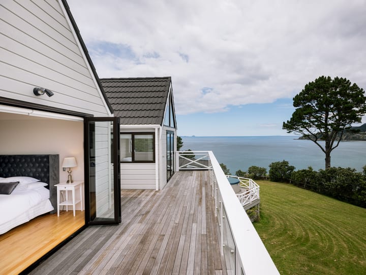 Accommodation deck and bedroom with a sea view and timber deck