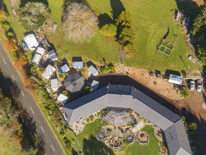 Aerial view of lodge complex with gardens, outbuildings and surrounding paddocks