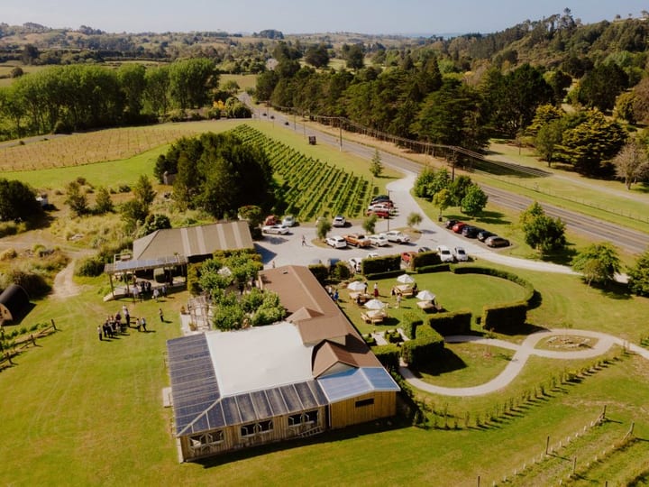 Aerial view of winery venue and vineyards with car park and marquee