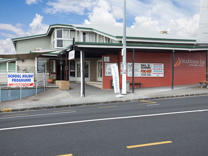 Community centre building on main road with signage for hall hire