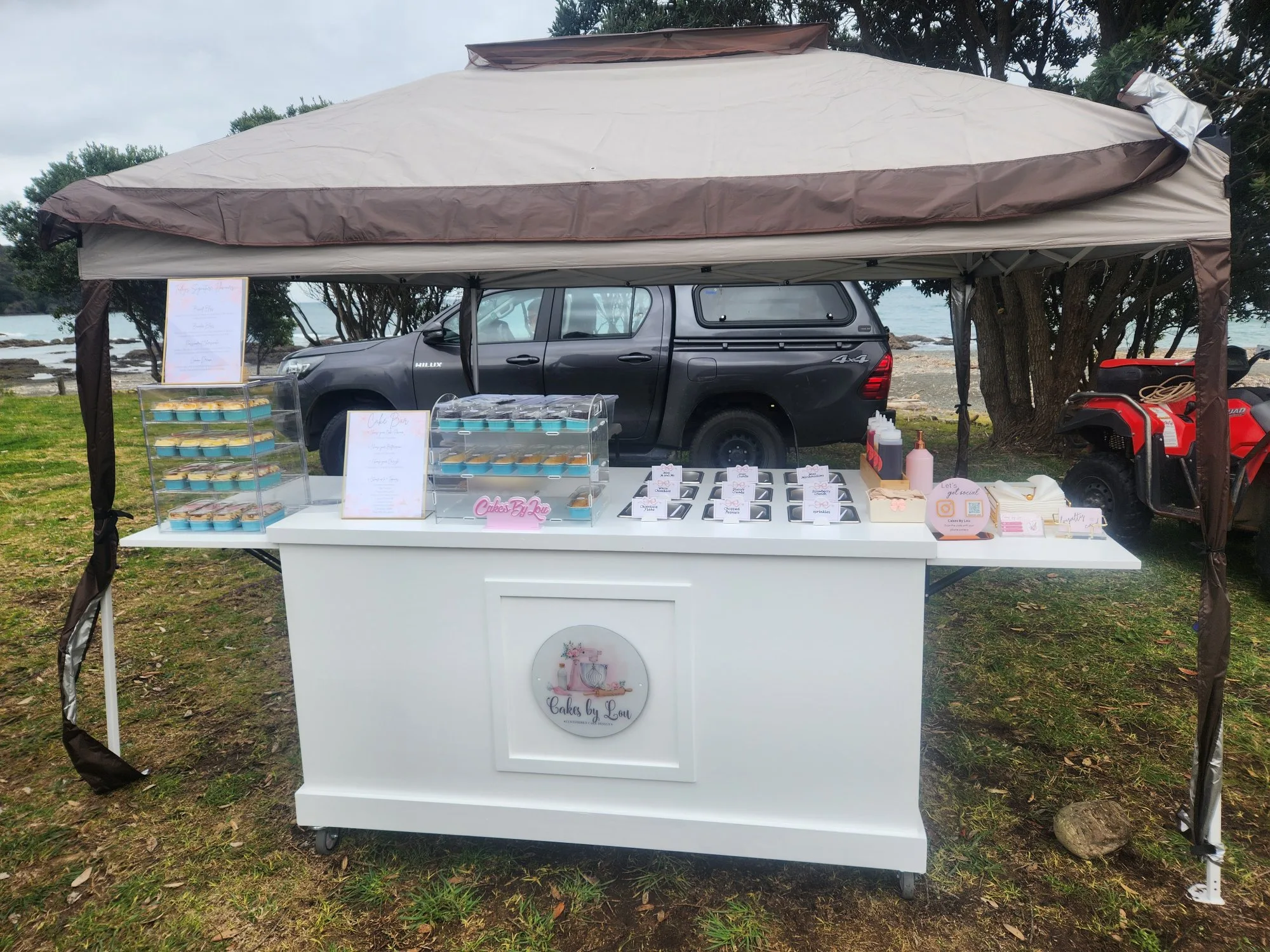 Mobile cake cart setup at outdoor event