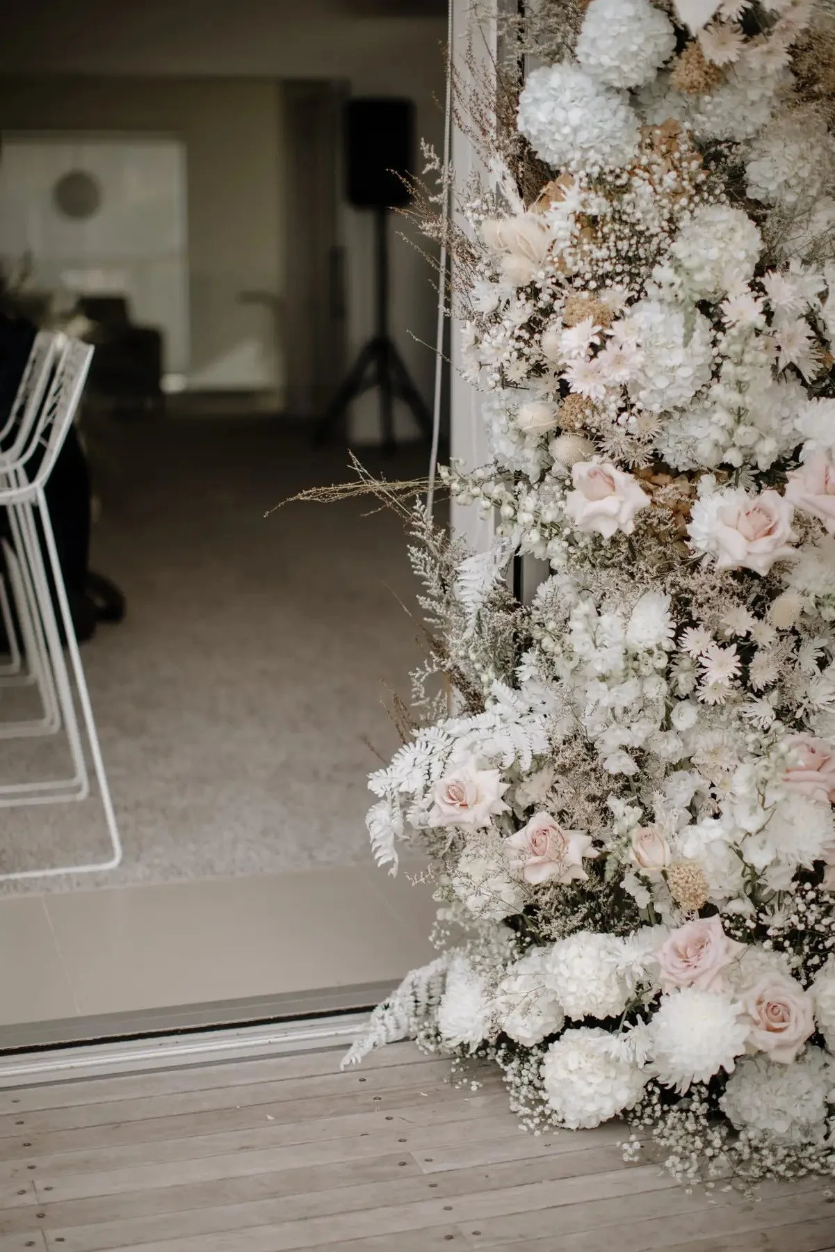 Floral ceremony backdrop installation