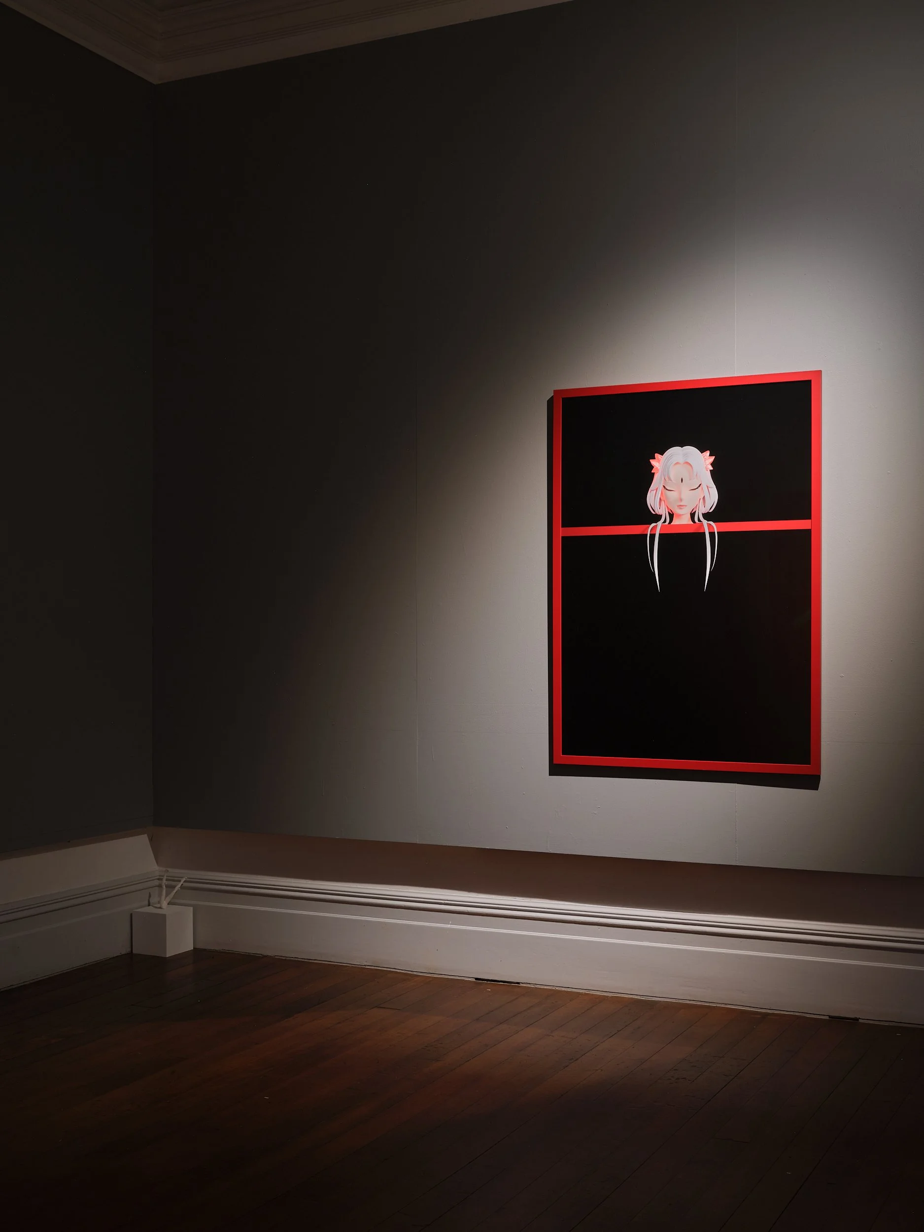 Dark-walled gallery room with single spotlit artwork in red frame, timber floor, ornate cornice
