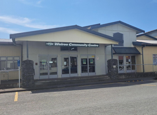 Front of the Wairoa Community Centre with entrance doors, signage and a car park